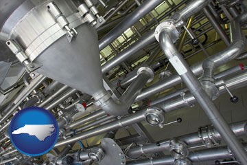 an industrial, stainless steel piping system - with North Carolina icon