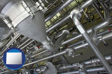 an industrial, stainless steel piping system - with Wyoming icon